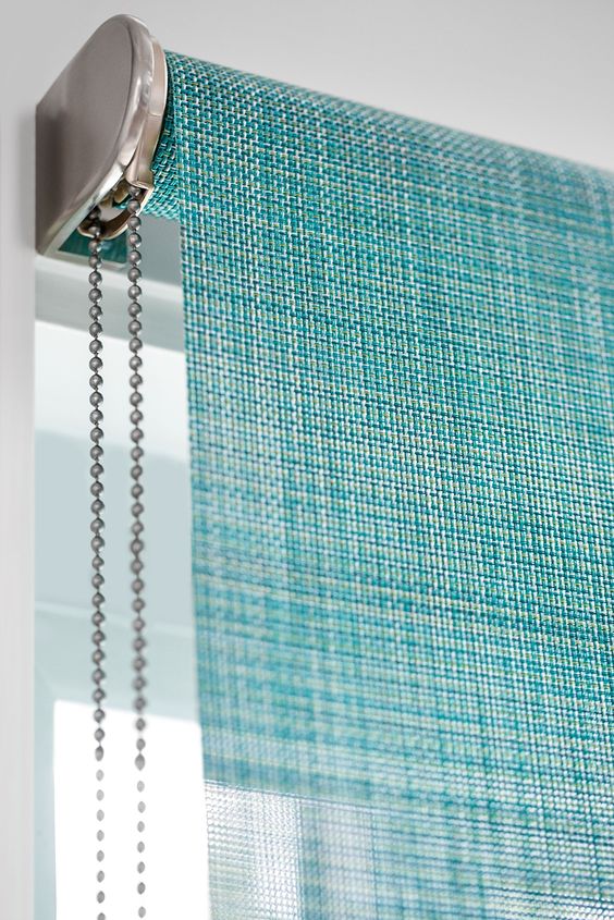 Beautiful Close-up shot of colorful roller blinds Curtains Vs Blinds